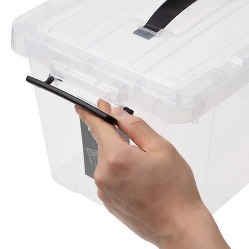 A hand closing the latch on a clear Marcolo storage box.