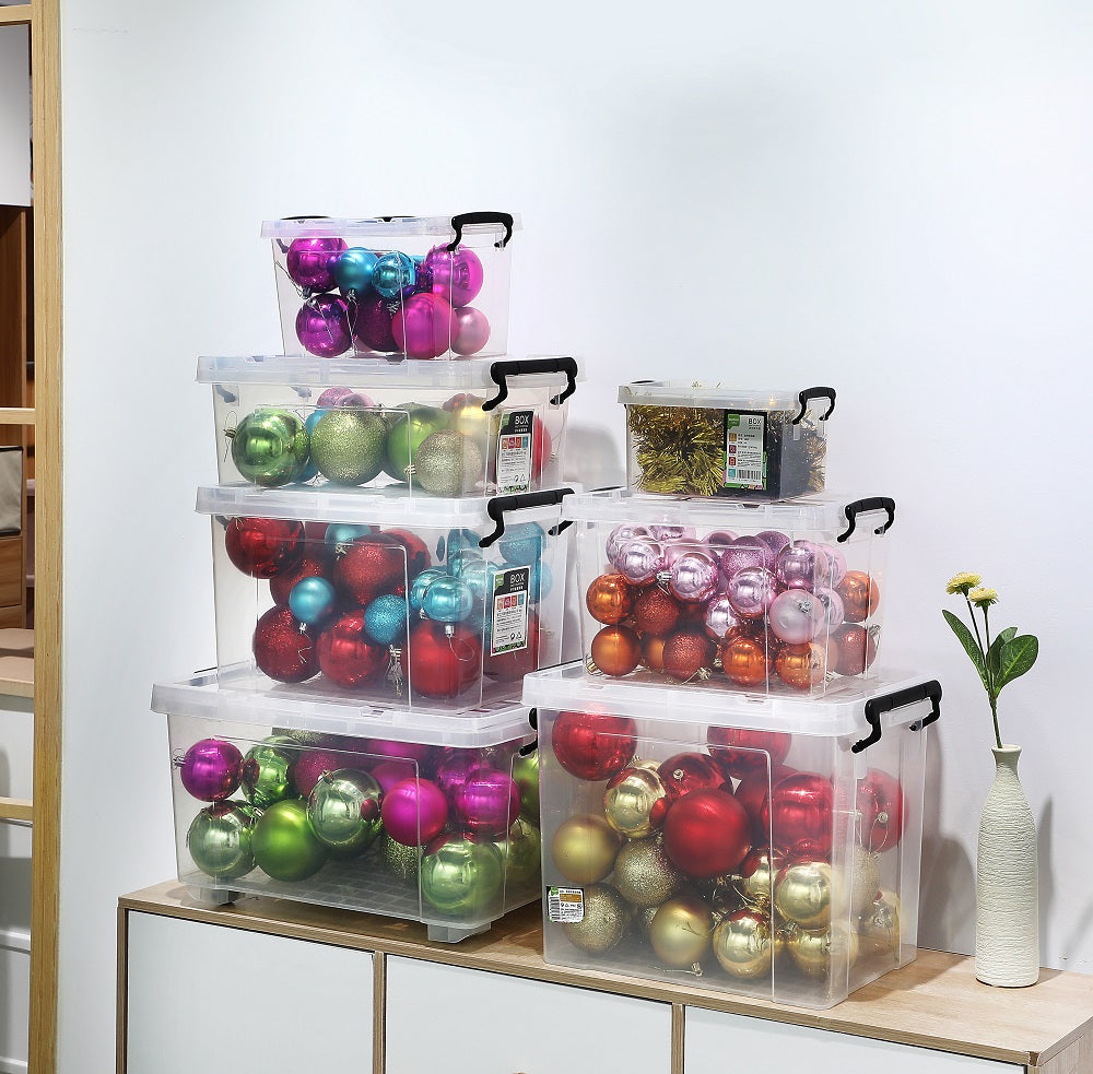 Marcolo storage bins filled with colorful Christmas ornaments.