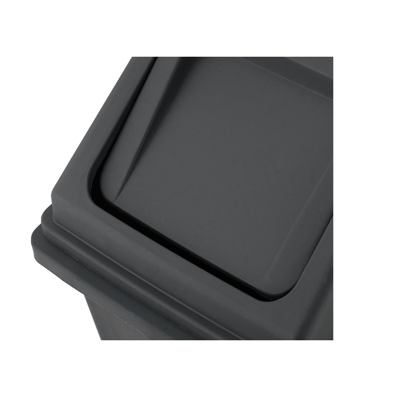 Close-up of a Marcolo trash can's dark gray flip-top lid.