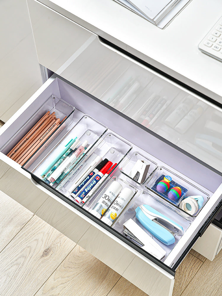 Marcolo clear drawer organizers with office supplies.