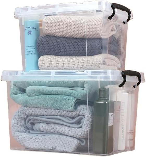 Stacked clear Marcolo storage boxes with blankets.
