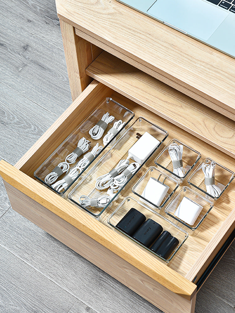 Marcolo clear drawer organizers holding electronics cords.
