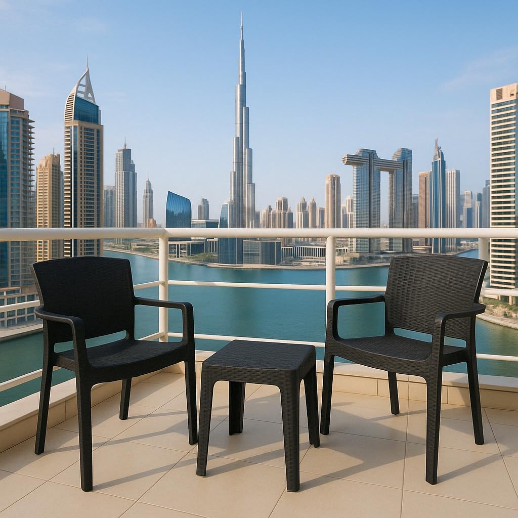 Marcolo black plastic patio chairs and table on a balcony.