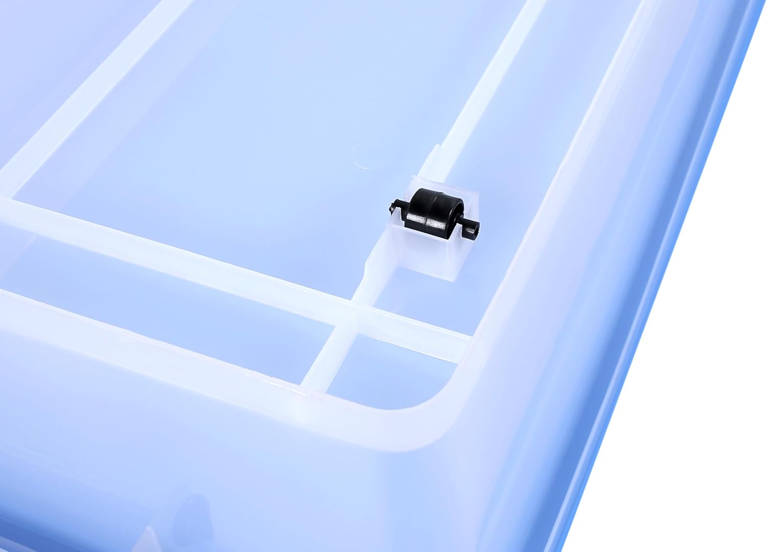 Close-up of a small black vent on a blue Marcolo storage lid.