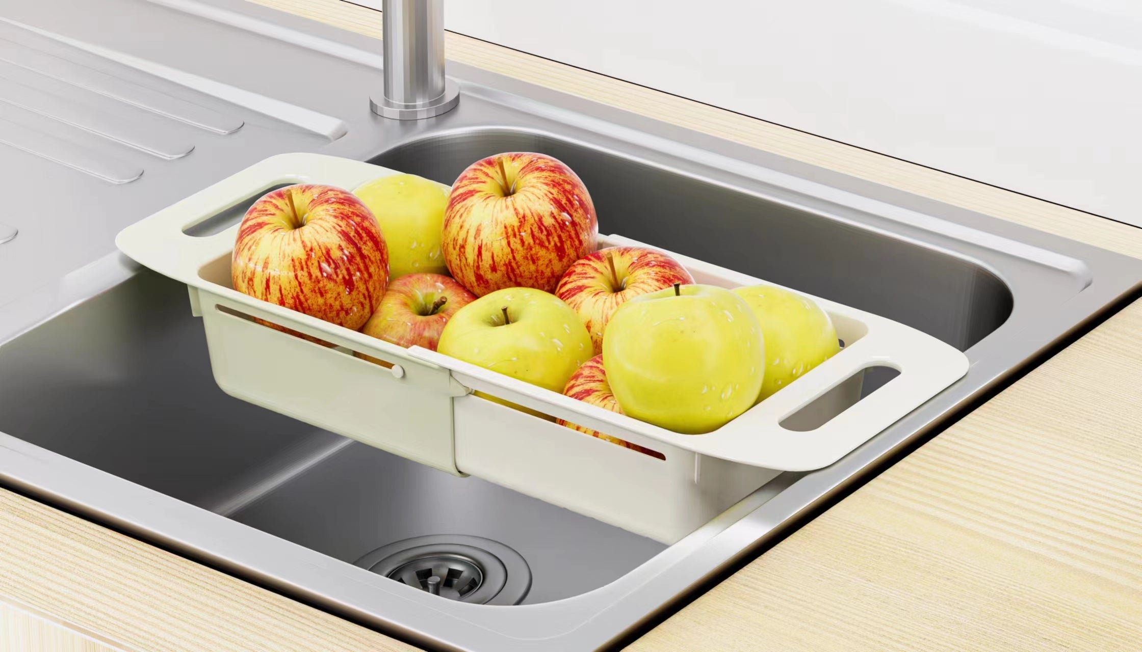 Marcolo expandable sink draining basket with apples.