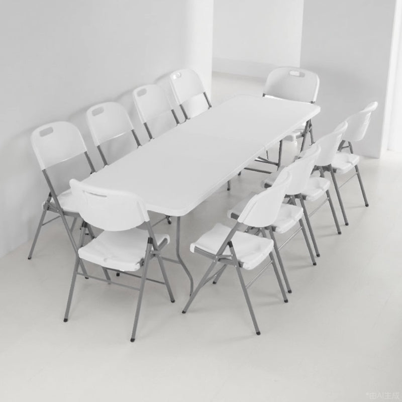 Marcolo white rectangular folding table and folding chairs.