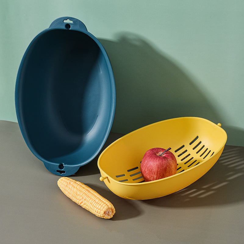 Two colorful plastic Marcolo colanders with fruit/corn.