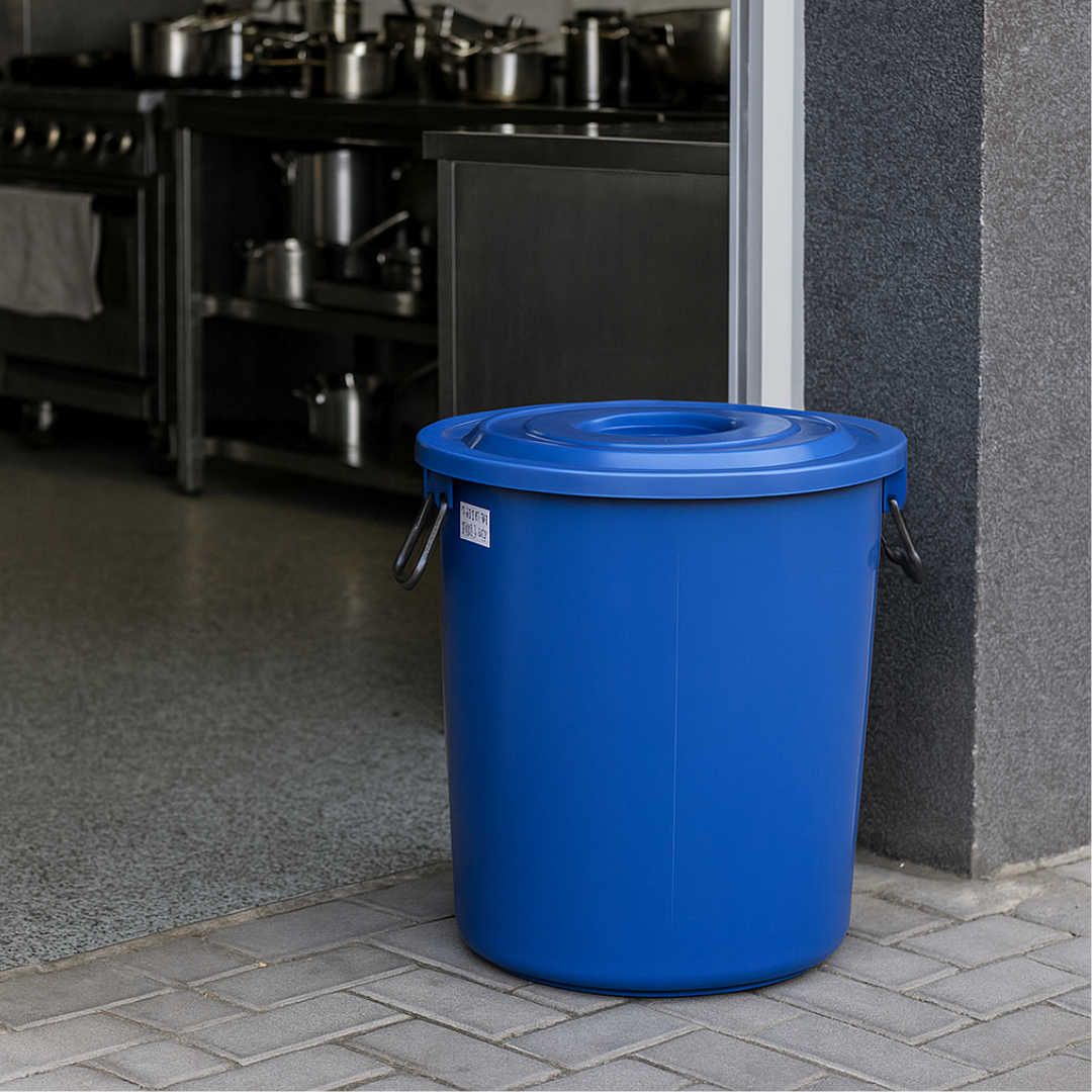 Marcolo large blue plastic barrel with a lid and metal handles in a kitchen area.
