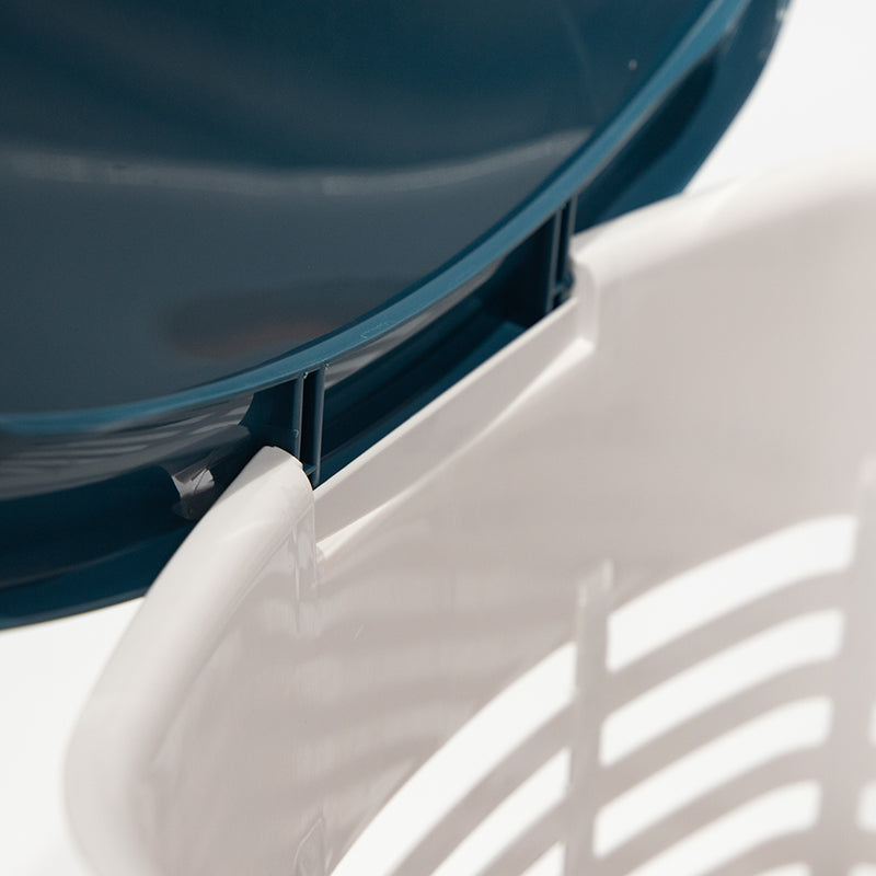 Close-up of the rim of a white and teal Marcolo dish rack.