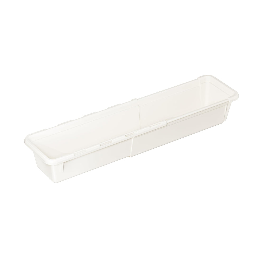 A long, narrow, white, plastic drawer organizer tray.