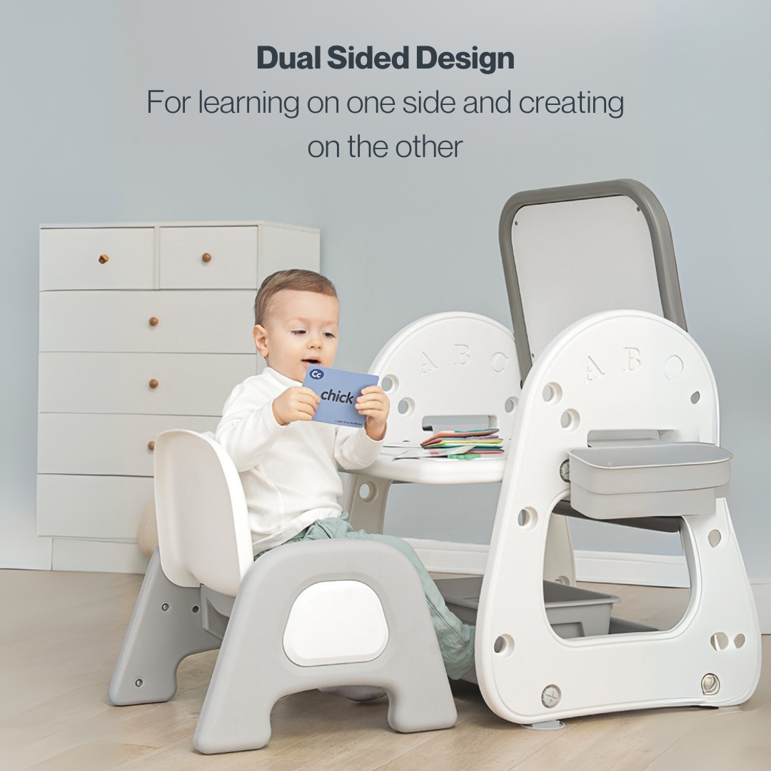 Toddler at a Marcolo dual-sided art and activity table.