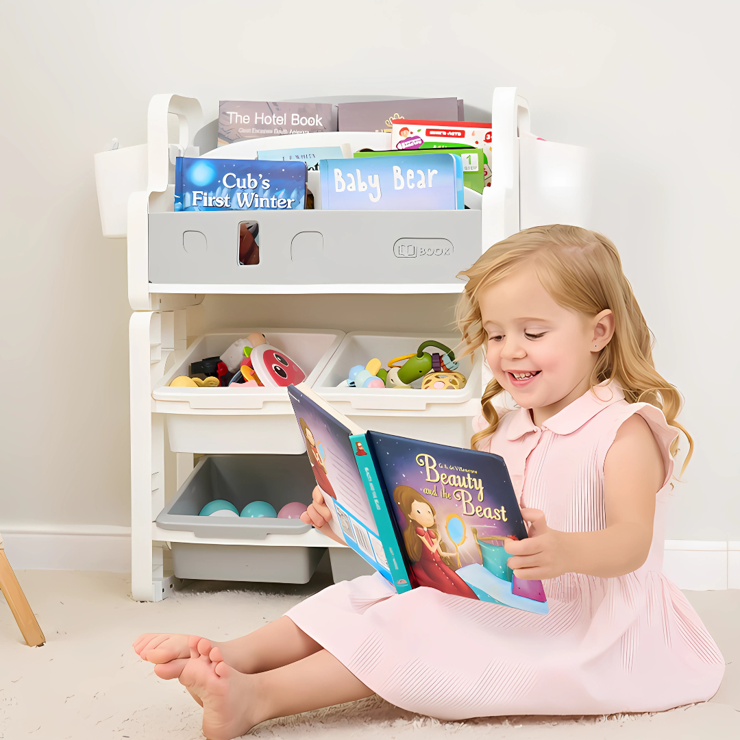 Toddler reading a book next to a Marcolo kids' bookshelf.
