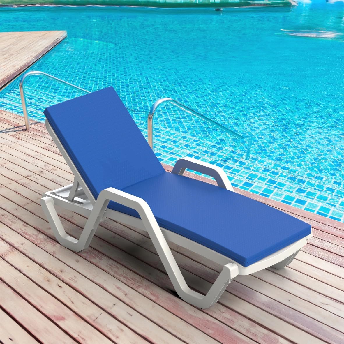 White Marcolo plastic sun lounger with blue cushion by a pool.