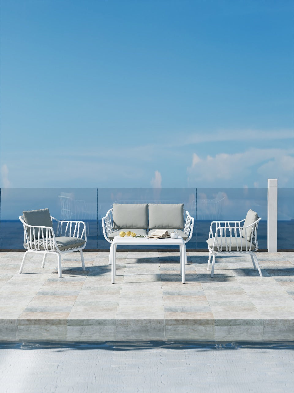 Modern white patio furniture set with sea view.