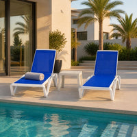 Java fiberglass sun lounger set with 2 loungers and side table by a villa pool