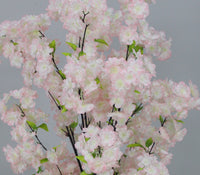 Close-up of pink blossoms and green leaves on the Marcolo artificial cherry blossom tree, 150 cm
