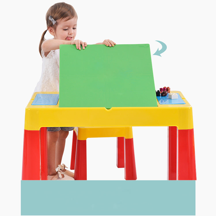 Child playing at the yellow and brown kids activity table