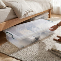 Marcolo 35L underbed storage box being slid under a bed