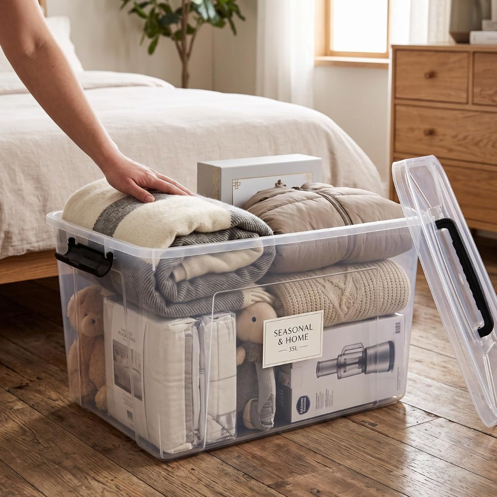 Marcolo 35L Super Clear PET storage box beside a bed, holding folded clothes