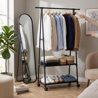 Smart 2-tier garment rack with hanging clothes in a bedroom