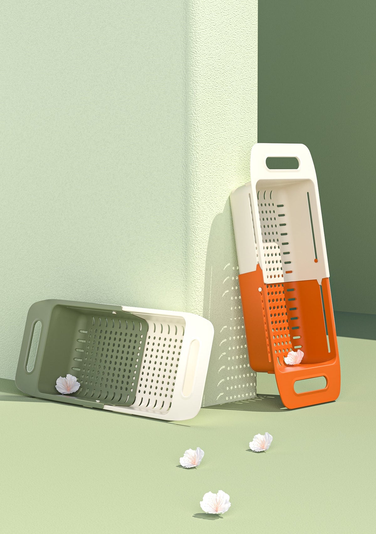 Marcolo adjustable colander drain baskets in green and orange, standing upright