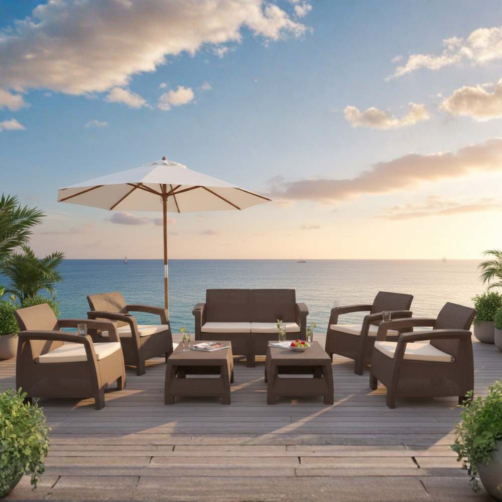 Dark brown Havana rattan-look sofa sets with a parasol on a seaside deck