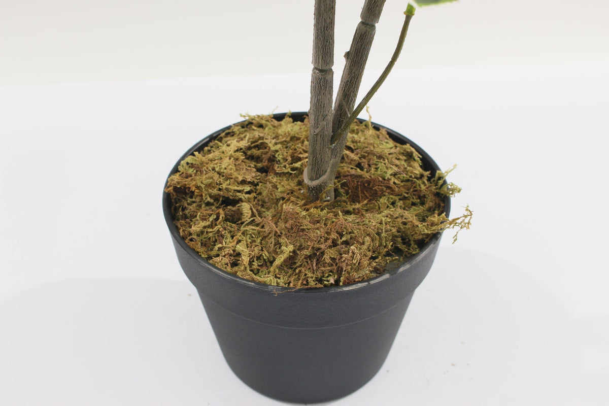 Base of the Marcolo 130 cm artificial schefflera umbrella tree in a black pot