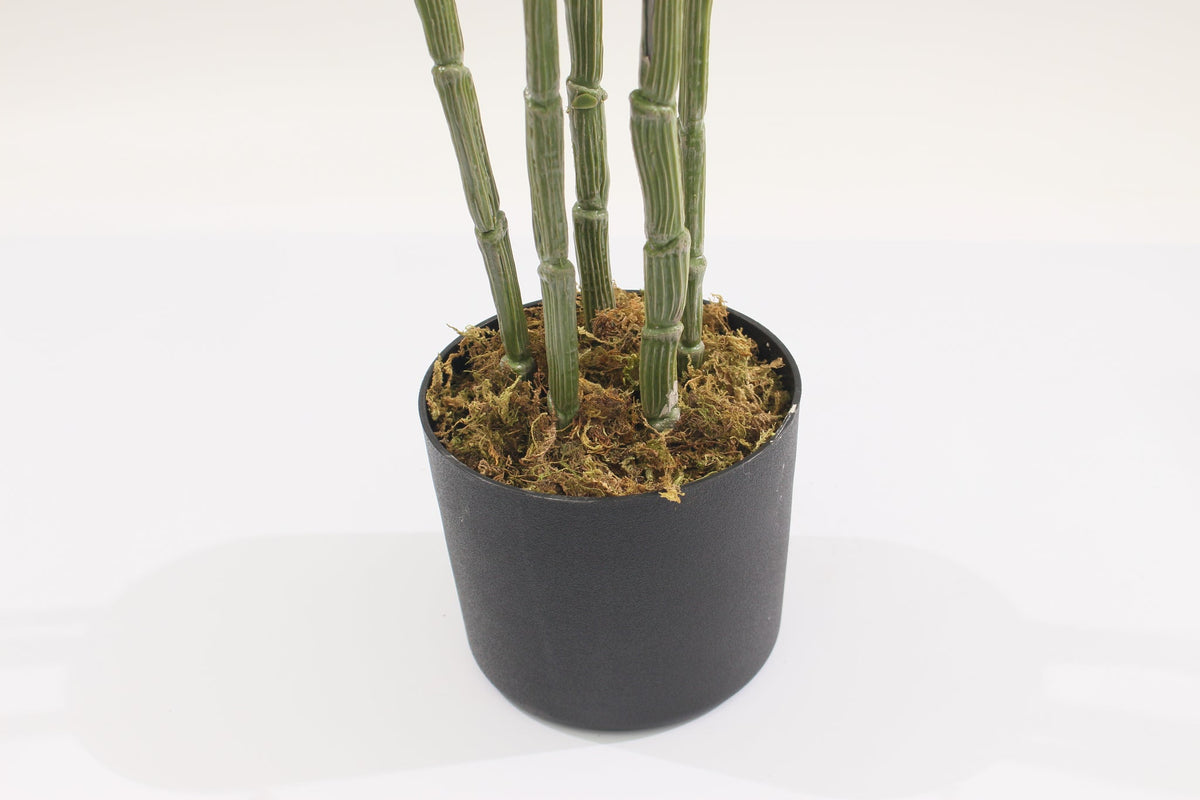 Base of the Marcolo 120 cm artificial monstera plant in a black pot
