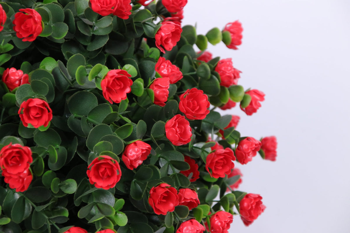 Close-up of red flowers on Marcolo artificial rose bonsai