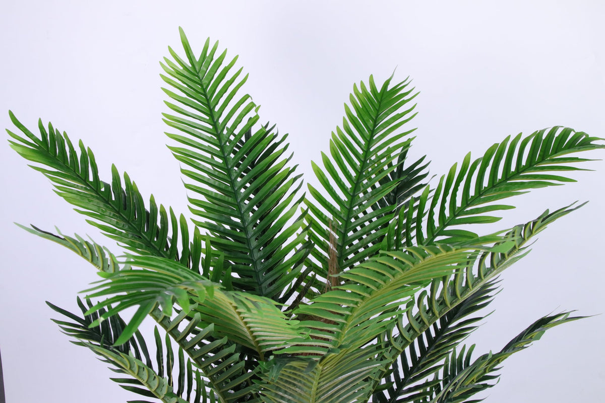 Close-up of the green fronds of the 150 cm artificial Persian palm