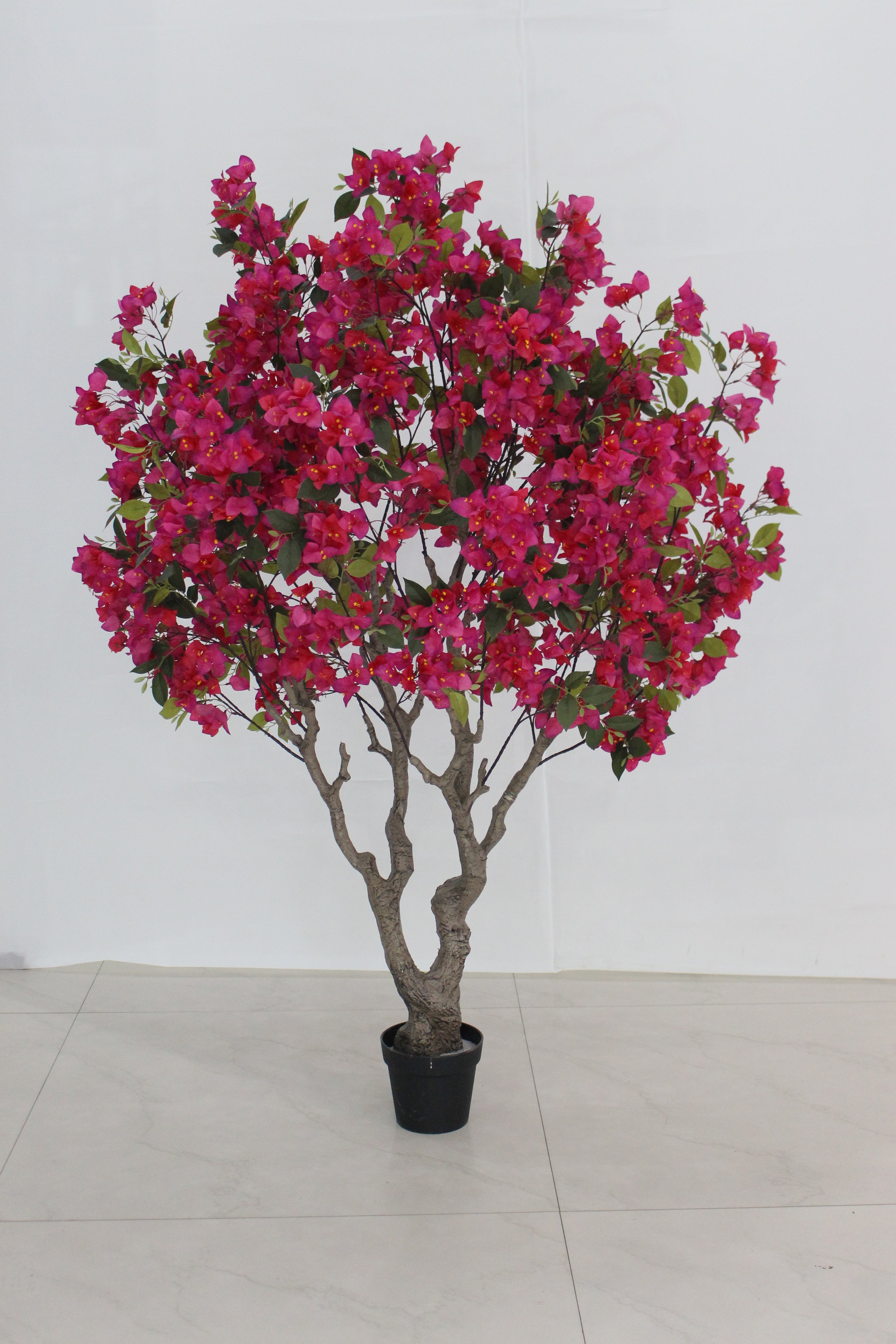 Marcolo 150cm artificial bougainvillea tree with lush magenta flowers and a natural-look trunk.