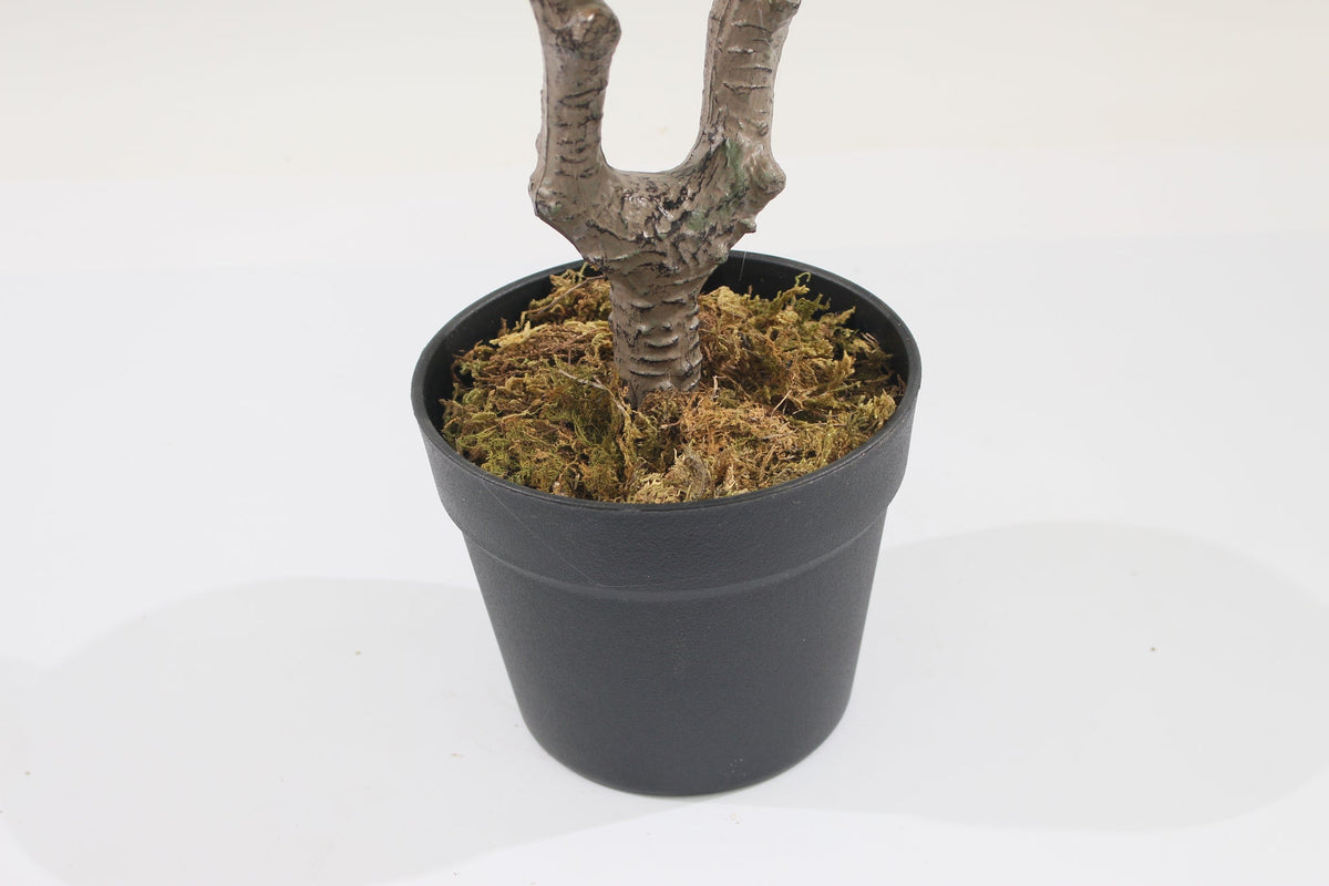 Base of the Marcolo 90 cm artificial schefflera umbrella tree with a branching trunk in a black pot