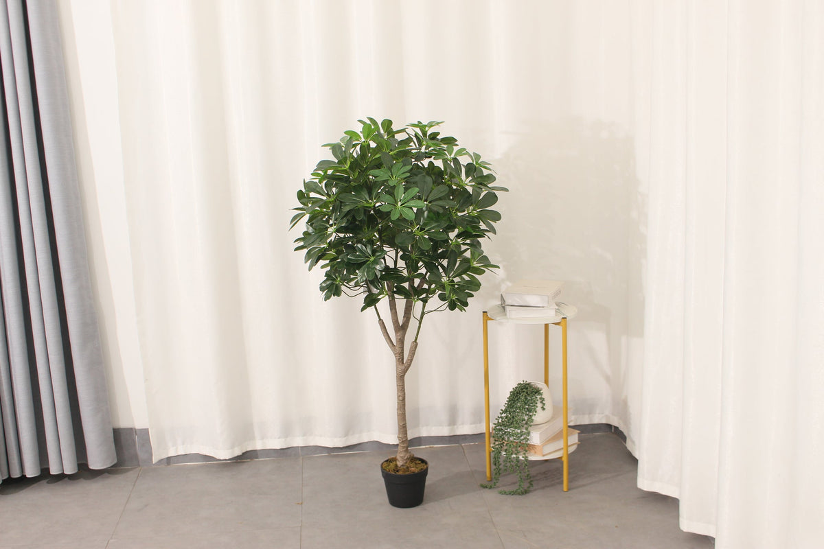 Marcolo 120 cm artificial schefflera umbrella tree in a room beside a side table