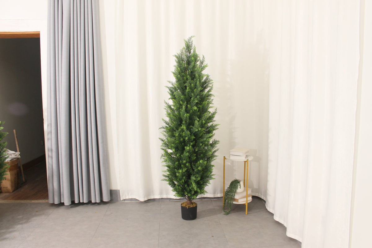 Marcolo 180 cm artificial pine tree in a room with curtains