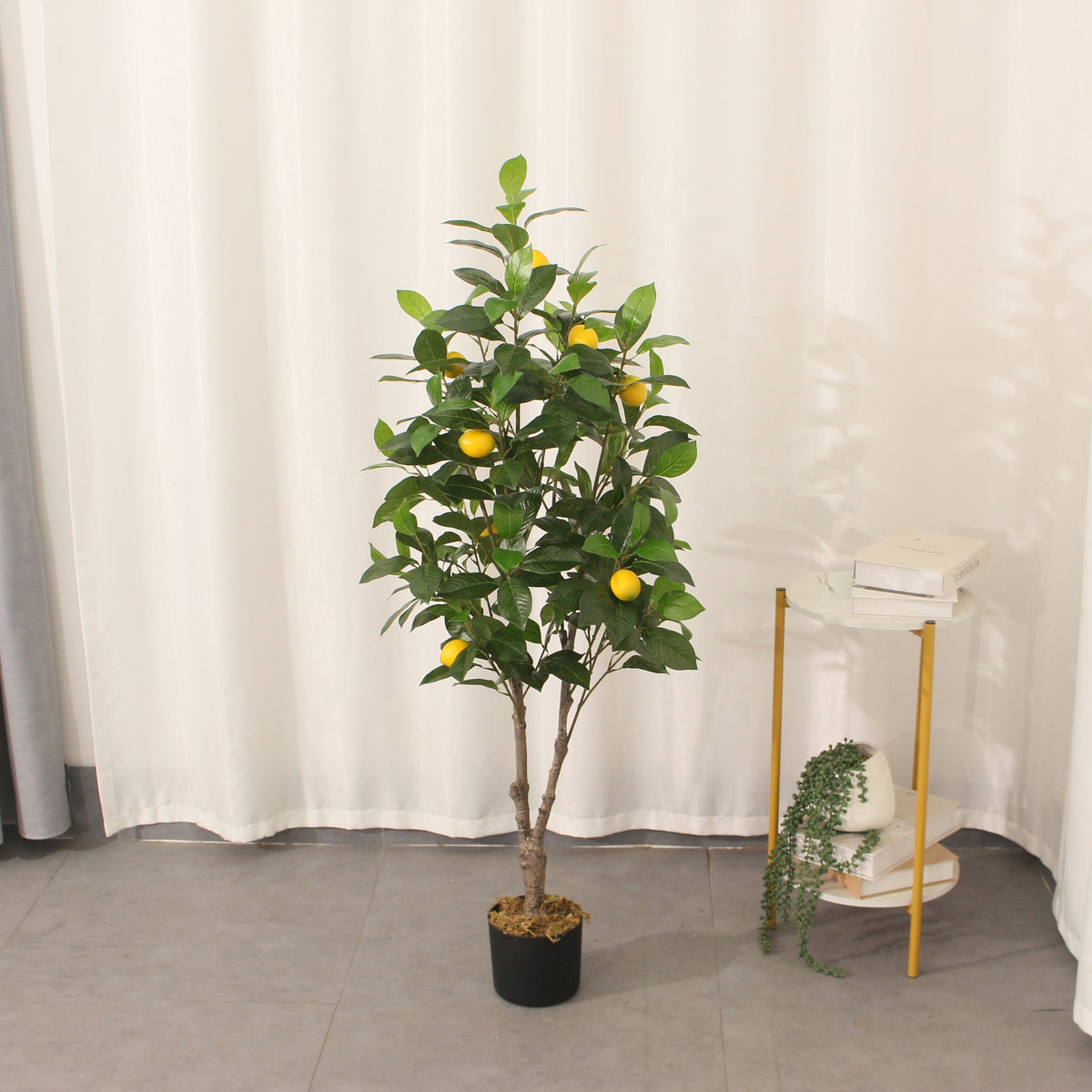 Marcolo 130 cm artificial lemon tree in a room beside a side table