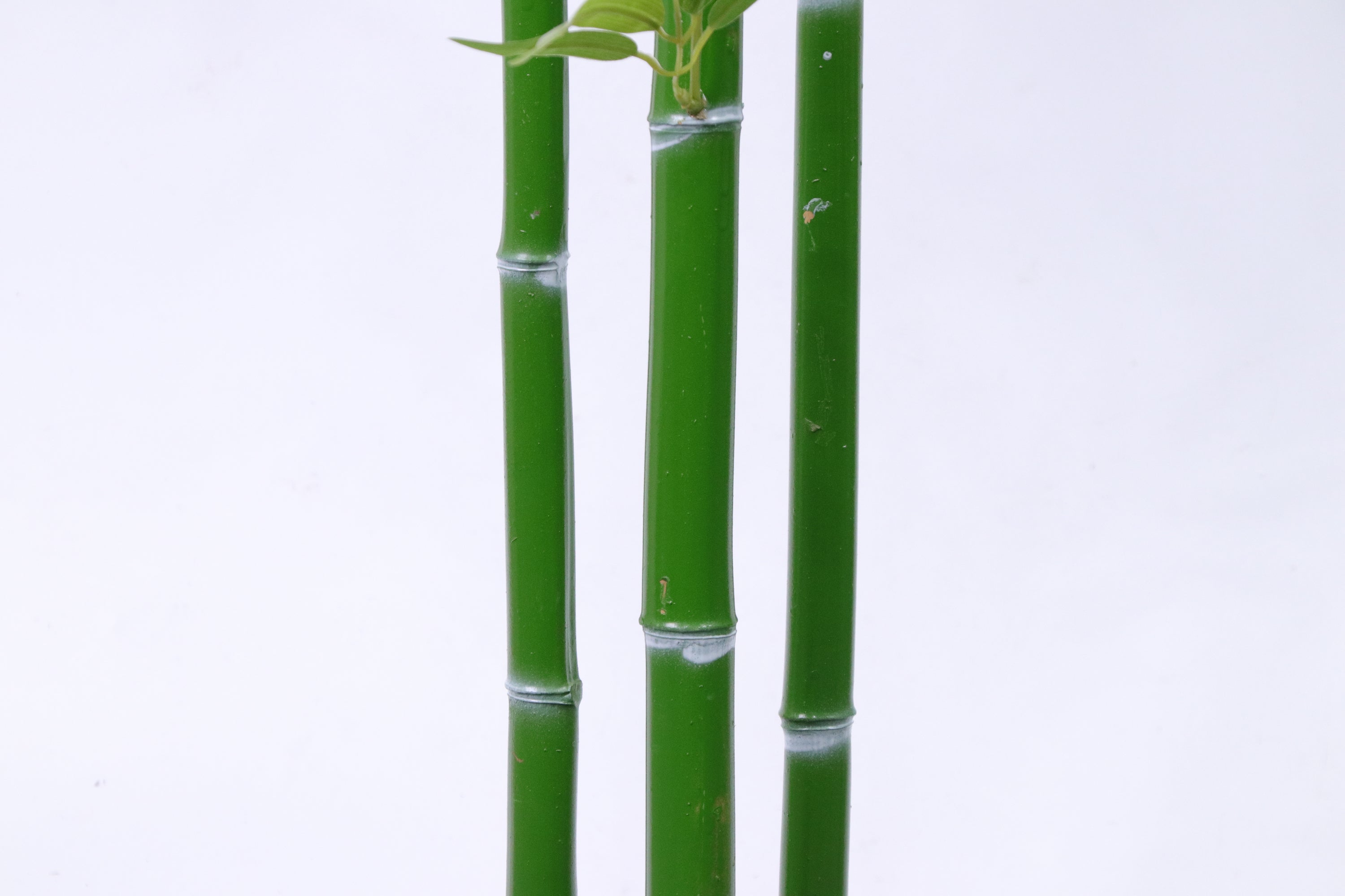 Marcolo artificial bamboo stalks with realistic green nodes and a smooth, vibrant texture.