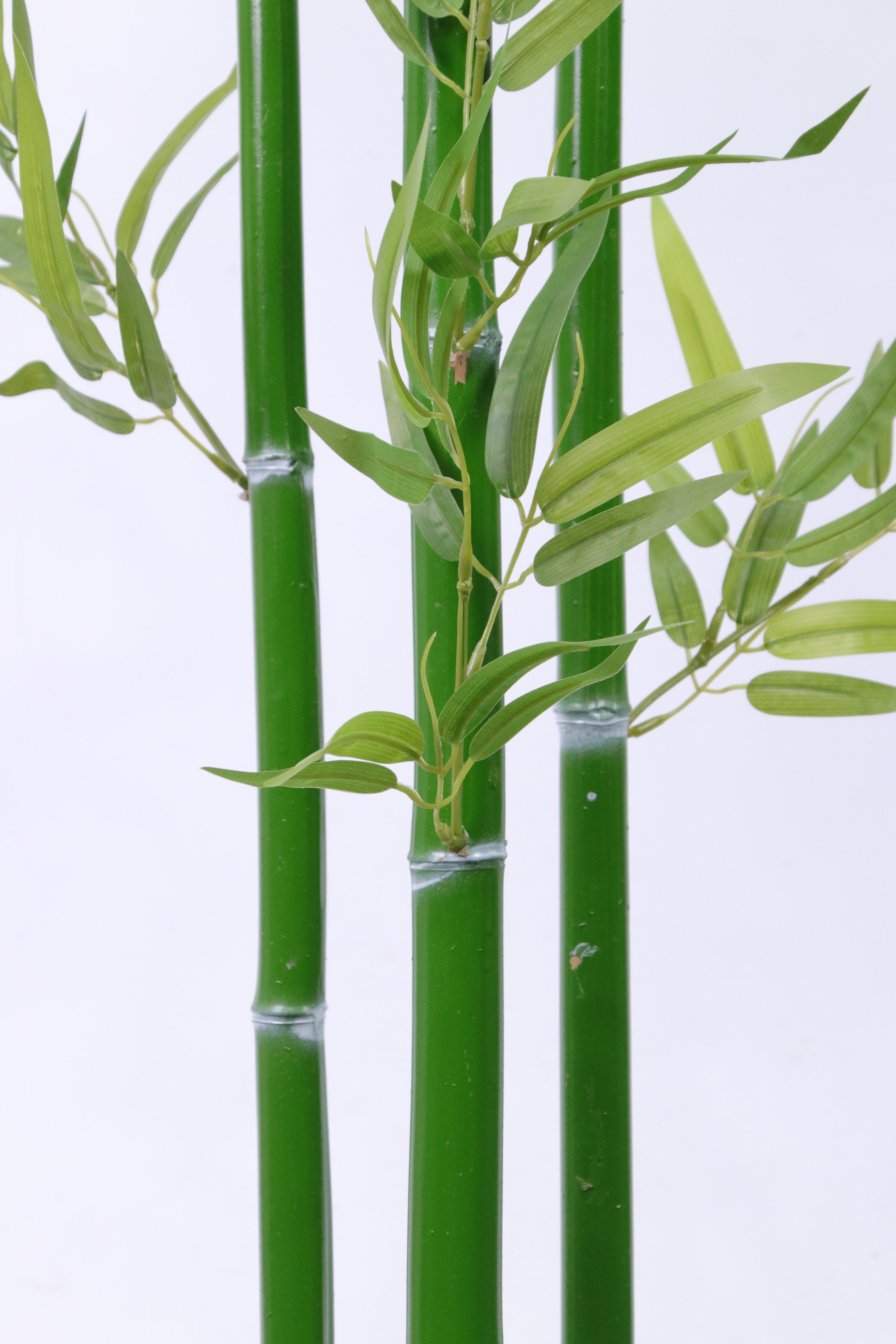 Marcolo artificial bamboo plant featuring realistic green stalks and detailed leaves.