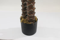 Marcolo 210cm artificial palm tree trunk in a black pot.