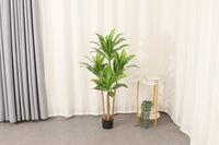 Marcolo artificial Dracaena tree in a home interior setting.