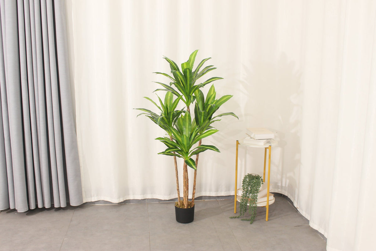 Marcolo artificial Dracaena tree in a home interior setting.