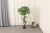 Artificial lemon tree, 120 cm, styled in a bright room corner