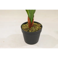 Base of a Marcolo artificial Dracaena tree in a black pot.