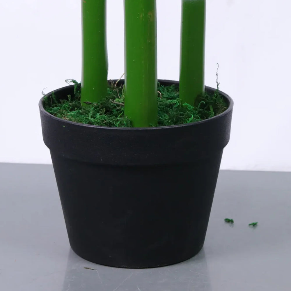 Marcolo artificial bamboo base featuring thick green stalks and moss in a black plastic pot.
