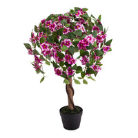 Artificial pink and white crabapple tree in a black pot.