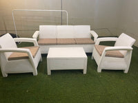 Customer photo: white Havana outdoor sofa with armchairs and table on a UAE lawn