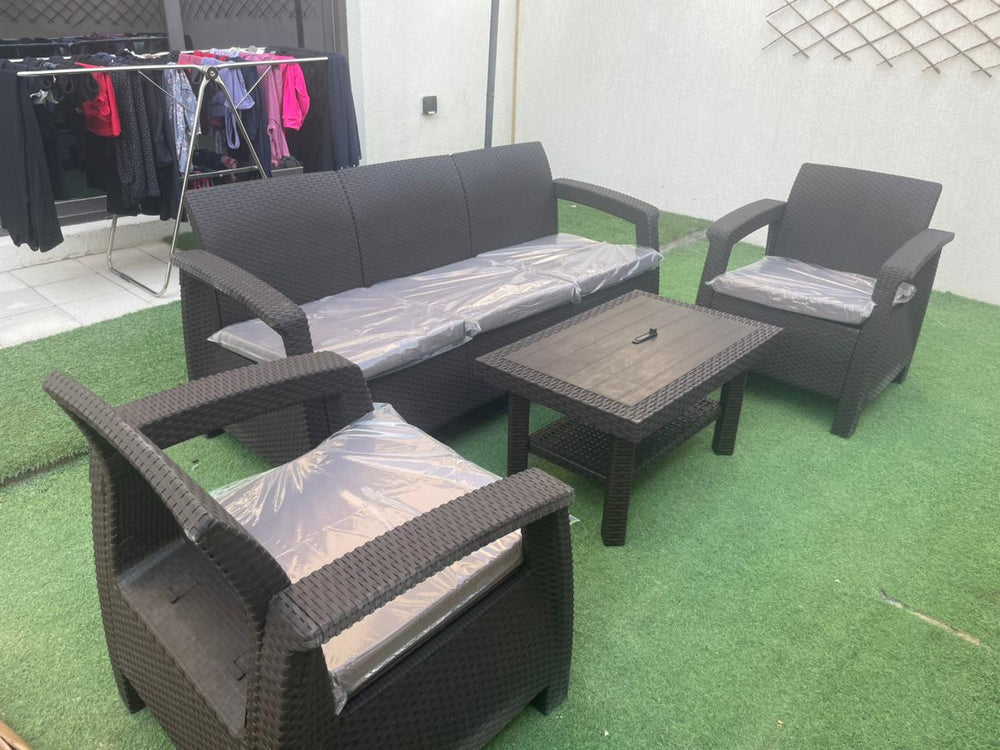 Customer's dark brown Havana rattan-look 5-seater sofa set on artificial grass in a UAE courtyard