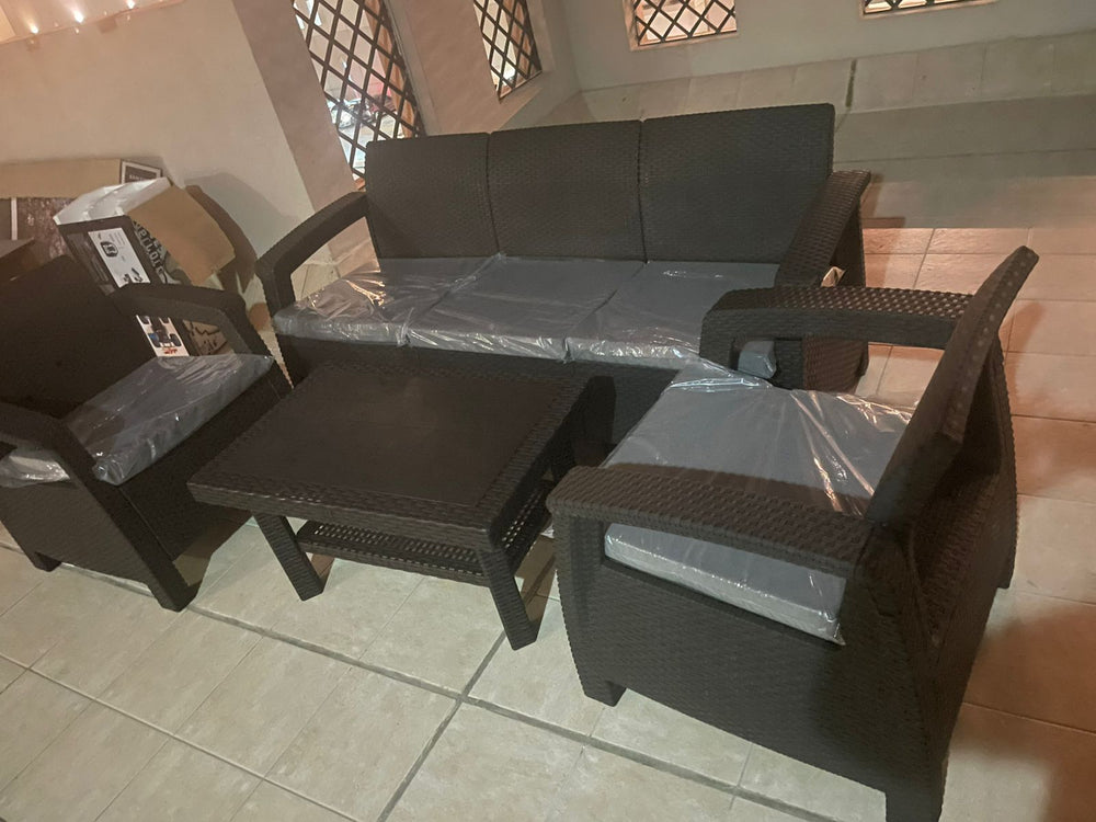 Customer's dark brown Havana rattan-look 5-seater sofa set on a tiled patio, just delivered