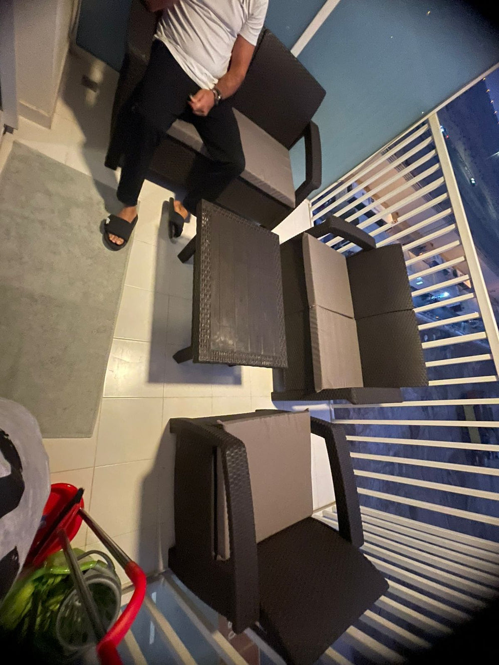 Customer's dark brown Havana rattan-look sofa set on an apartment balcony