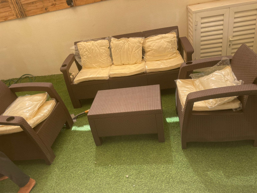 Customer's dark brown Havana rattan-look 5-seater sofa set with back cushions on an artificial grass terrace