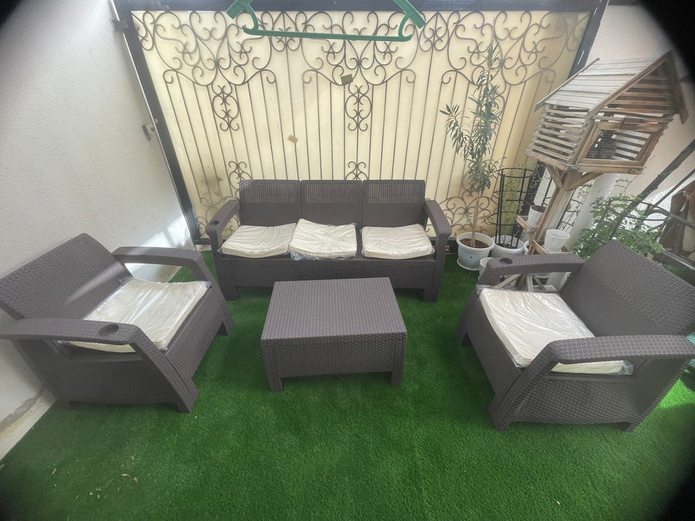 Customer's dark brown Havana rattan-look 4-seater sofa set on an artificial grass terrace